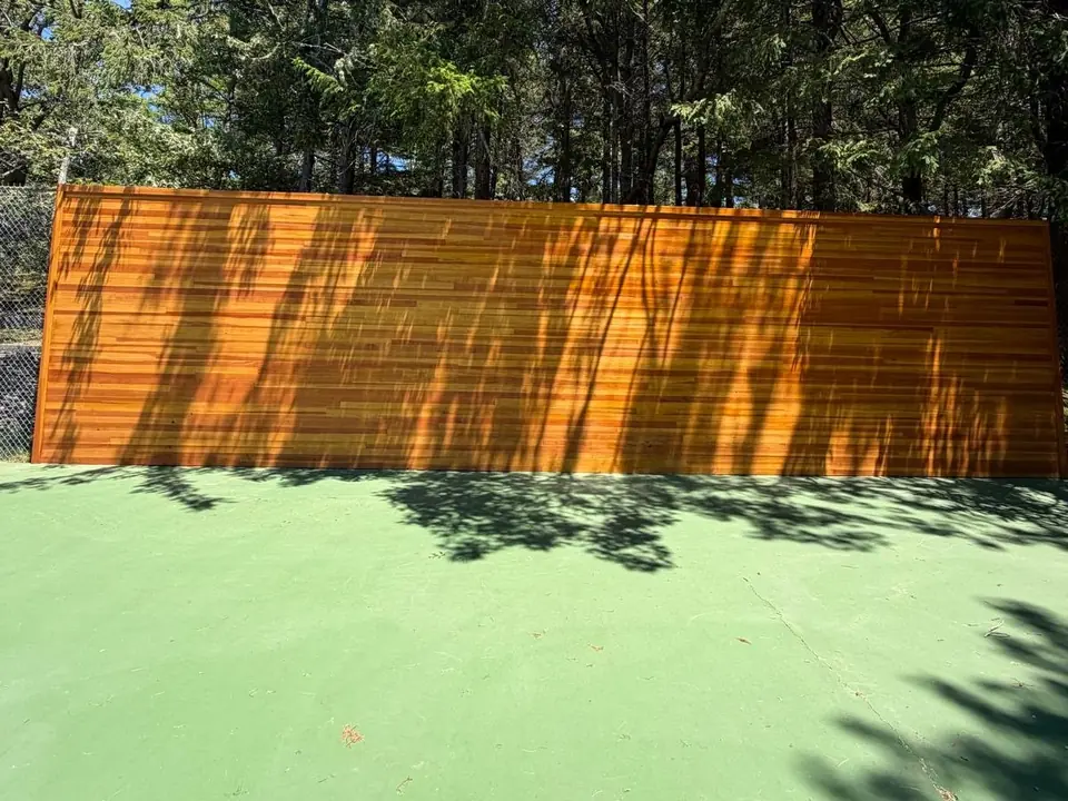 The same cedar wall after stain